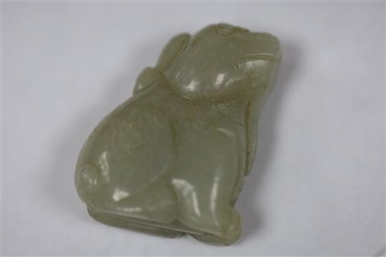A Chinese white jade two boys carving and a celadon jade lion-dog, H. 3.7cm and 4.4cm